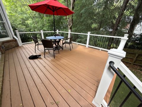 Composite deck with tan decking and white railing by Nelson Exteriors in Marietta, GA