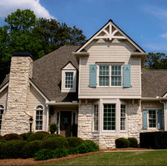 Residential home with light gray siding and stone exterior by Nelson Exteriors in Marietta, GA
