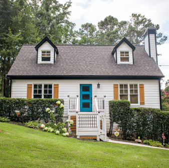 Residential home with white siding and dark shingle roof by Nelson Exteriors in Marietta, GA
