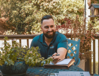 Nelson Exteriors sales rep discussing an exterior project with a homeowner in Marietta, GA